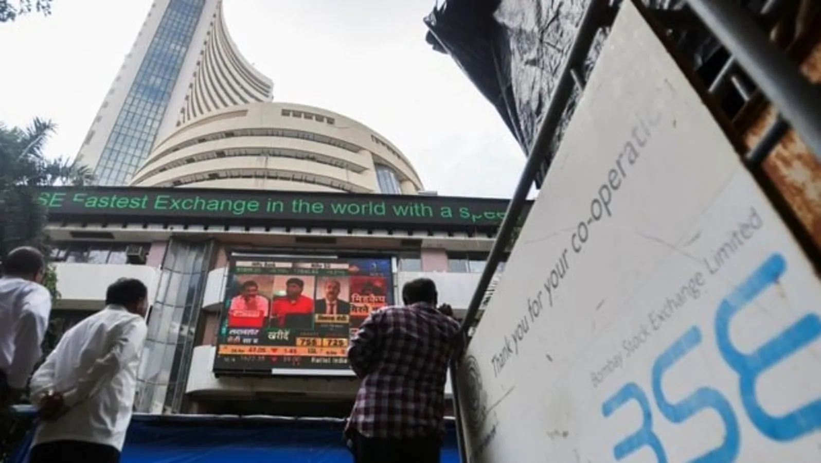 Sensex, Nifty slip into red in volatile opening trade